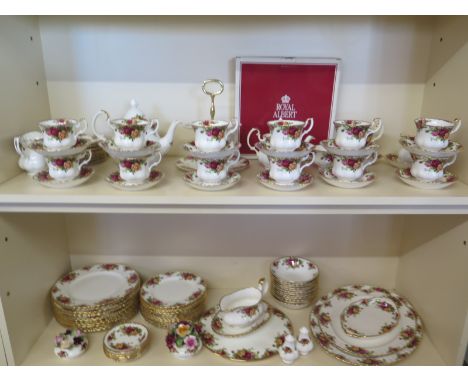 A Royal Albert - Old Country Rose - 97 piece tea and dinner service and a Royal Worcester centre plate, all with floral and g