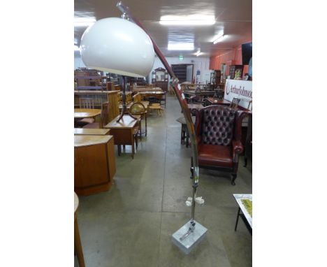 A French chrome and marble based floor standing arc lamp 