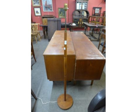 A teak standard lamp 
