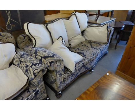 A Chippendale Revival carved mahogany and fabric upholstered three piece suite 
