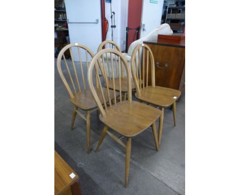 A set of four Ercol Blonde elm and beech Windsor chairs 