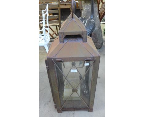 A large steel and glass garden lantern 