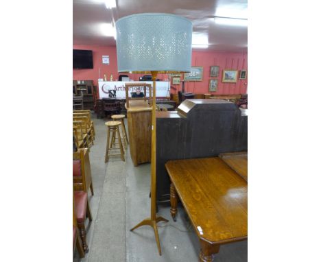 A teak standard lamp 