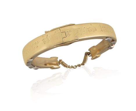 A HORSE-SHOE BANGLE Hinged and inscribed ‘Wear it for good luck’, inner diameter ca. 5.5cm Condition Report:  In general some