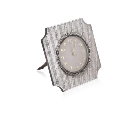 A SWISS-MADE, EIGHT-DAY TRAVEL CLOCKThe circular, silvered dial with golden Arabic numerals and hands, bordered with a Greek 