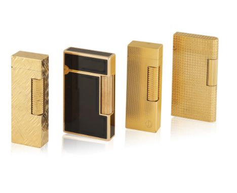 FOUR LIGHTERSIncluding two textured, gold-plated lighters by Dunhill; one textured gold-plated lighter by Caran d'Ache; and a