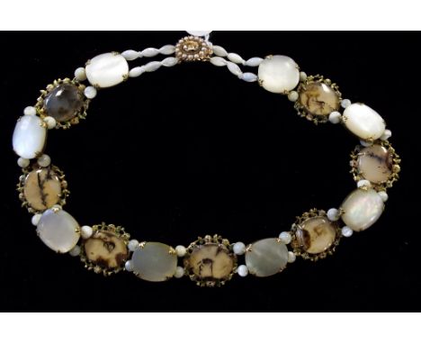 A moss agate, mother of pearl and milkstone choker, with enamel decoration, and seed pearl clasp
