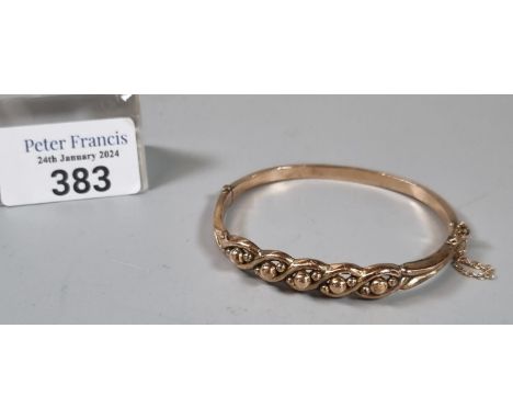 9ct gold bangle with entwined Celtic designs.  7.5g approx.   (B.P. 21% + VAT) 