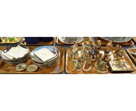 Two trays of West German Goebel Hummel figurines and collectors plates and similar items. (2)(B.P. 21% + VAT) 