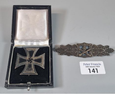 WWII period German Iron Cross first class in original fitted box. Together with another replica badge. (2) (B.P. 21% + VAT)  