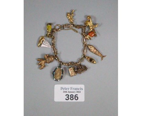 9ct gold charm bracelet with assorted charms including: kitten with ball, articulated fish, rabbit, poodle,&nbsp;&nbsp;enamel
