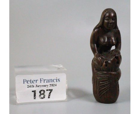 Japanese carved wooden Netsuke in the form of a mermaid curled around a rock.  Inset mother of pearl signature.  7.25cm appro