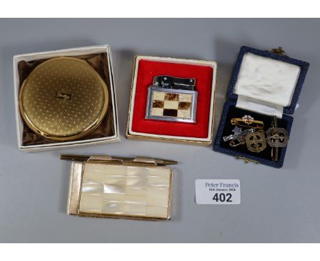 Vintage Stratton ladies compact in original box together with a mother of pearl and chrome lighter and silver brooches to inc