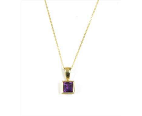 A gold amethyst pendant, with a square step cut amethyst, rub set to a plain collet with 'V' bale, suspended from a curb chai