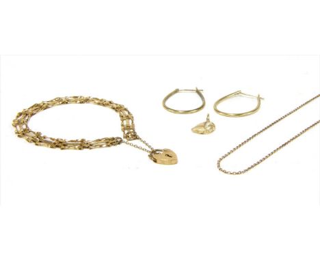 A quantity of gold jewellery, to include a pair of 9ct gold hoop earrings, a 9ct gold three row gate bracelet, a 9ct gold tra