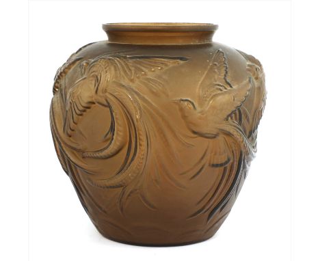 An Art Deco brown glass lamp base, moulded with exotic birds, w ith a drilled hole to the side, 28cm high