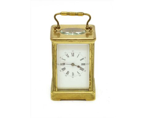 A 19th century carriage clock, striking one a gong, enamel dial, and key