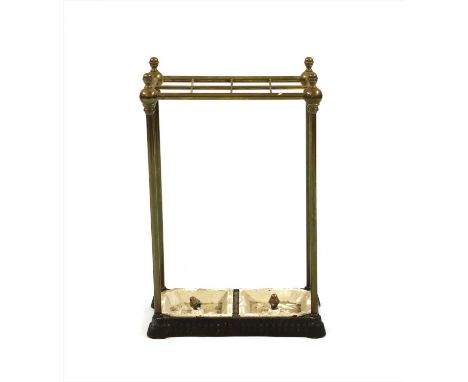 A Victorian brass and cast iron stick stand , with 8 divisions and two lift out trays. 62.5cm high