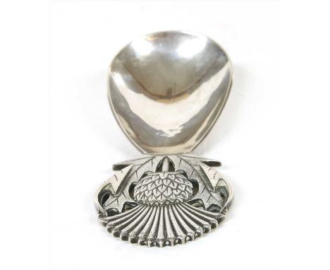 A silver caddy spoon, London 1963, maker R. E. Stone, the handle in the form of a pierced thistle, with facsimile signature t