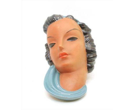 A Goldscheider terracotta wall mask, c.1930, in the manner of Kurt Goebel, with blue scarf and hair band, printed mark to rev