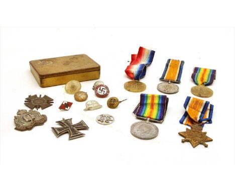 A collection of First World War medals etc , comprising War Medals, Victory Medals, a 1914-1915 star, a Suffolk Regiment badg