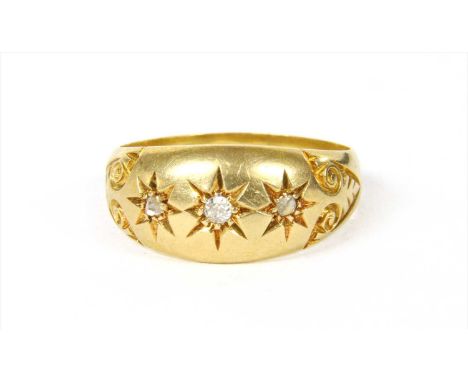 An 18ct gold diamond ring, an old eight cut diamond with a rose cut diamond at each side, all star set to the domed head, wit