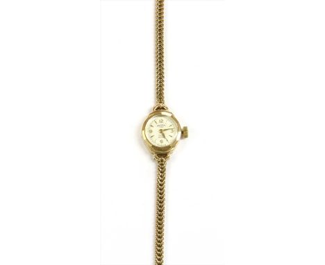A ladies' 9ct gold Rotary mechanical bracelet watch, silvered dial with gilt baton hour markers and Arabic numerals at the qu