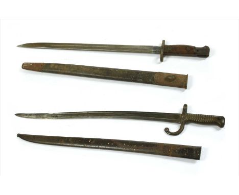 A 19th century French bayonet , together with an English bayonet, the French bayonet signed to the top of the blade and the E