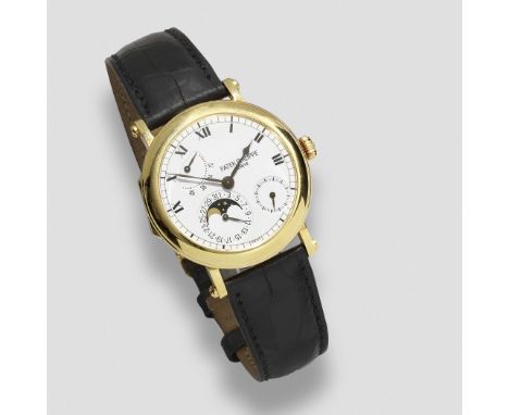 Patek Philippe. An 18K gold automatic calendar wristwatch with moon phase and power reserveReference: 5054JDate: Circa 2000Mo