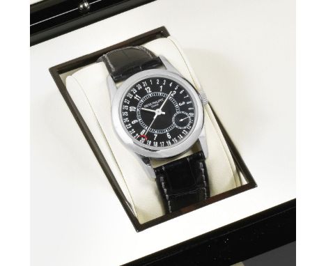Patek Philippe. An 18K white gold automatic calendar wristwatchModel: CalatravaReference: 6000GDate: Purchased 3rd November 2