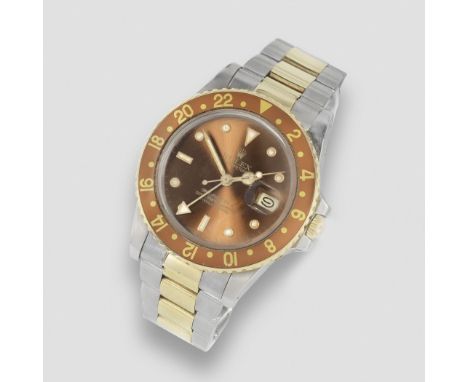 Rolex. A stainless steel and gold automatic calendar bracelet watch with dual time zoneModel: GMT MasterReference: 16753Date: