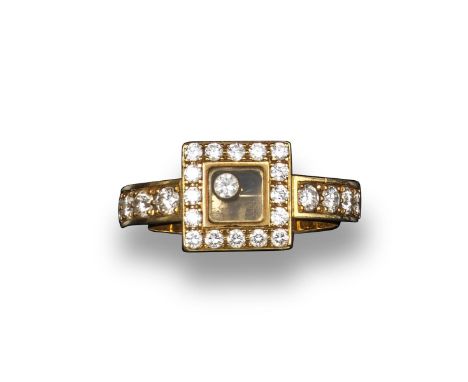 A Happy Diamonds ring by Chopard, the rectangular plaque set with circular-cut diamond border, the central compartment contai