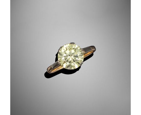 A fancy-coloured diamond solitaire ring, the round brilliant-cut diamond weighs 3.94cts and is set in yellow gold,Accompanied