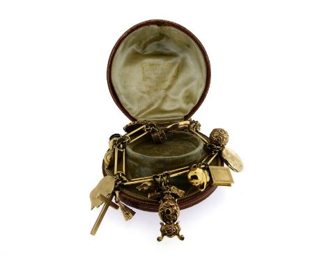A gold charm bracelet, the rectangular and circular link bracelet with assorted charms including a basket of puppies, a clock