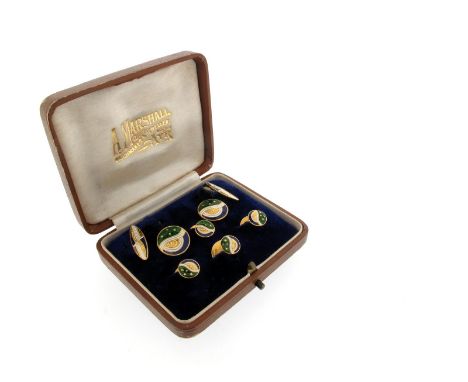 A pair of polychrome enamel cufflinks, of abstract design an decorated with guilloche enamel, with four matching studs in yel