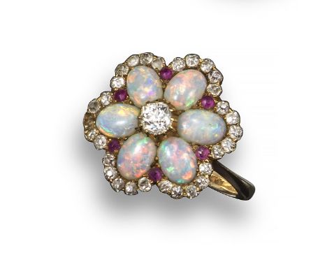 A diamond, opal and ruby-set cluster ring, of flower head form and centred with an old circular-cut diamond within six white 