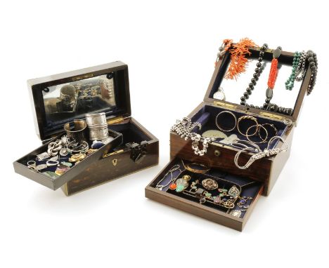 Two jewellery caskets containing an assortment of jewellery including a lapis lazui cabochon mounted gold bracelet, a garnet-