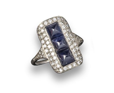 An Art Deco sapphire and diamond plaque ring, the three sugarloaf sapphires are set within a surround pave-set with diamonds 