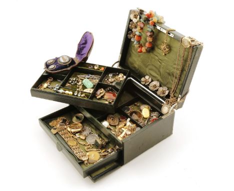 A jewellery casket containing a quantity of jewellery including a gold gate-link bracelet set with a sovereign, a gold pendan