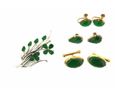 A white gold foliate brooch, mounted with eleven pear-shaped jadeite cabochons, 6cm high, a pair of gold earrings set with ov