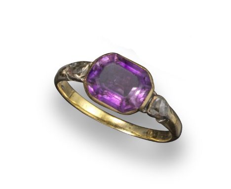 A George III amethyst and diamond ring, the amethyst set in a gold closed-back mount with two rose-cut shoulder diamonds, siz