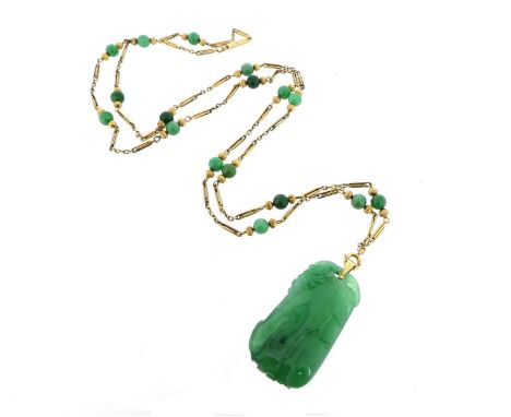 A carved and pierced jade pendant on a gold chain, suspending from a gold fancy-link neck chain with jade beads, pendant 4.9c