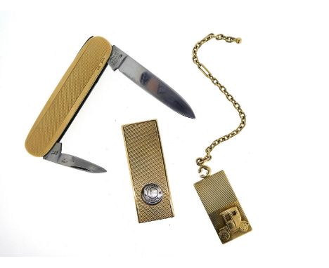 A gold penknife, with engine turned decoration, a gold cigar cutter and a gold charm depicting a car on an oval-link chain
