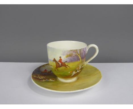A Royal Worcester Demitasse & Saucer, hand painted with hunting scenes, signed Albert Shuck.