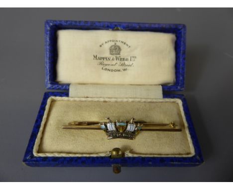 A 9 ct Gold and Enamel Coronet Brooch in Mappin & Webb Box, the box approx 5 cms, approx 3.6 gms.