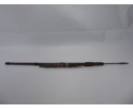 Two African Spears, one with metal decoration, approx 94 cms, the other with bound hide decoration, approx 46 cms, together w