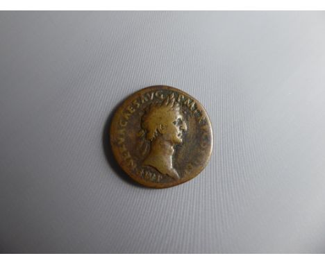 A First Century AD Roman Coin, depicting Nero Caesar Augustus right profile and a palm tree SC to the reverse.