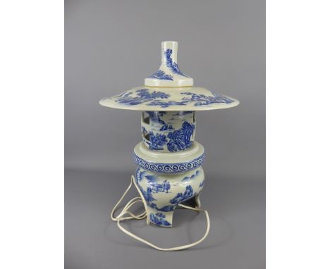 A Chinese Blue and White Lamp, in the form of a temple, the lamp decorated with landscape scenes, approx 44 cms