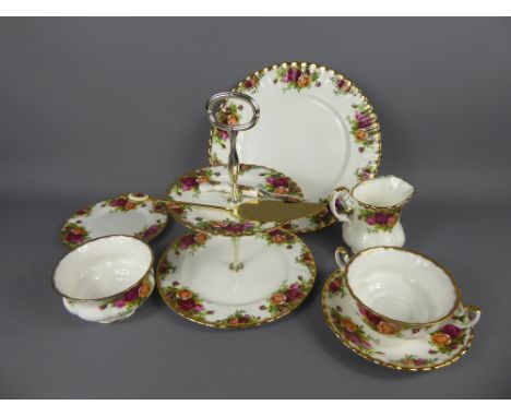 A Set of "Old Country Roses" Porcelain, comprising teapot, twelve tea cups, twelve saucers, milk jug, sugar bowl, cake plate,