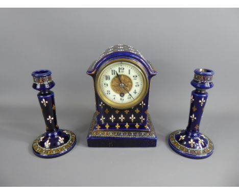 A Victorian Cobalt Blue Ceramic Mantle Clock and Garniture, decorated with fleur de lys, approx 15 cms.